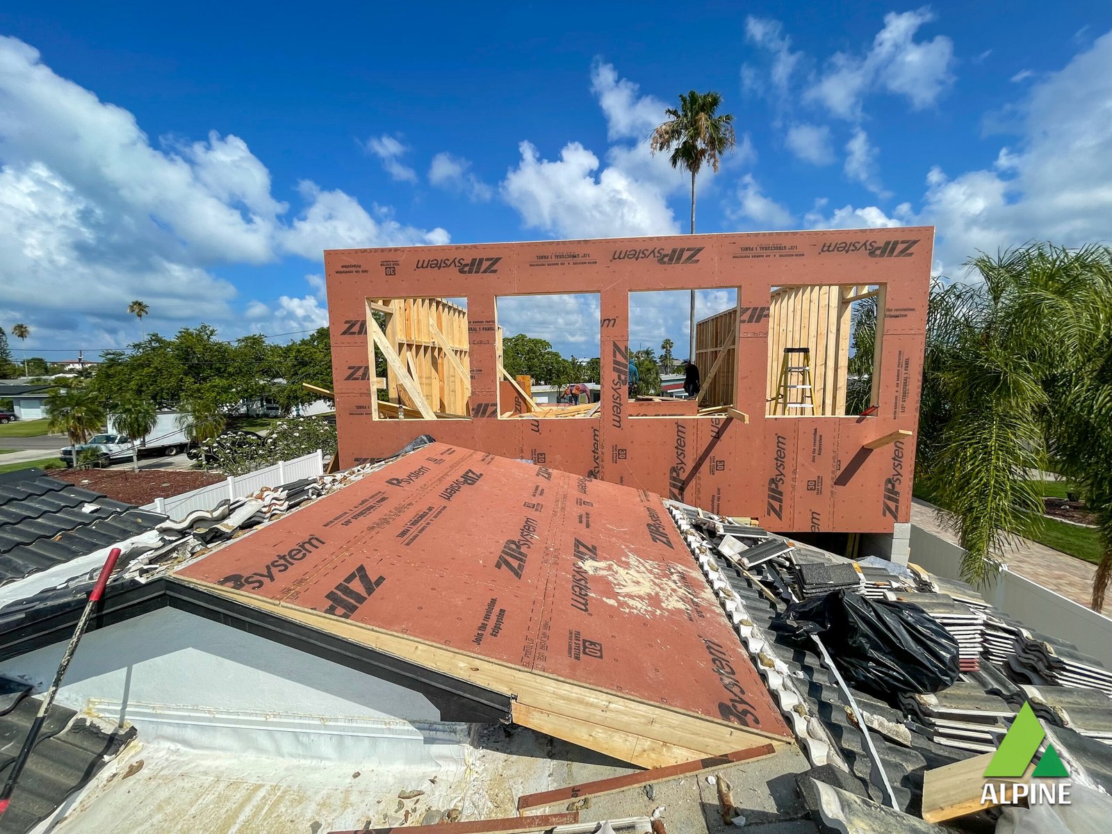 Restoration crew assessing property loss in storm-damaged Pinellas home